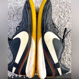 Men’s Size 11 Nike Tiempo. Black with white accents. Black laces.